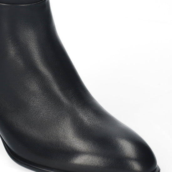 Vista lateral de las botas de piel para mujer Biarritz Boots de caña alta, punta redonda y tacón de bloque de 6,5 cm en color negro de BIBI LOU.